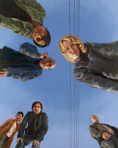 four people are standing in the middle of a painting, looking up into the sky