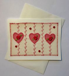 two cards with hearts and flowers on them