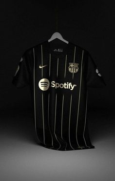 a soccer jersey hanging on a hanger with the word spotify printed on it