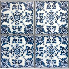 four blue and white tiles with floral designs