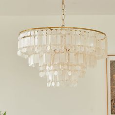 a chandelier hanging from the ceiling in a room