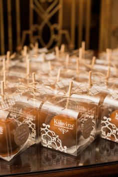 chocolate candies are lined up on the table for guests to take their own pictures