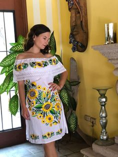 Mexican peasant dress embroidered with sunflowers and lace details, with drawstring at the waist. Mexican textile art has centuries of history and creativity throughout the country. Mexico is recognized as one of the leading countries with a beautiful aristic production in the textile world, miraculous hands of talented artisans from different states of the country create stunning embroidery clothing, and various items. #Oaxaca #Chiapas We ship anywhere in the word, from Tepic, Nayarit, mx. Made Hand Embroidered Dress, Blanket Dress, Embroidery Clothing, Mexican Textiles, Sunflower Dress, Mexican Dress, Mexican Dresses, Ethnic Dress, Peasant Dress