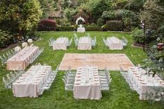 an outdoor wedding set up with tables and chairs