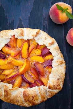 a fresh peach pie on a wooden table