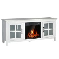 a white entertainment center with a fire in the fireplace and glass doors on both sides