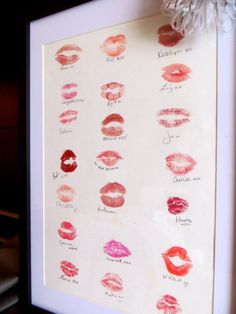 a white frame with red and pink lipsticks in different shapes, sizes and colors