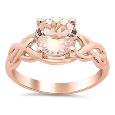 a rose gold ring with an oval stone in the center