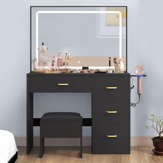 a vanity with a mirror, stool and lights on the top shelf in front of it