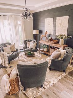 a living room filled with furniture and a chandelier