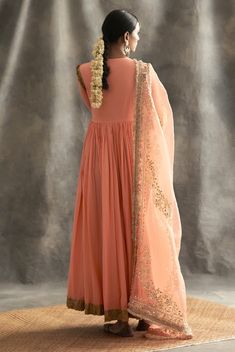 This set features a kurti with one of the kind embossed khadi highlighted with dabka and zardozi,the 2 paneled sharara also has the intricate khadi blocking, while the dupatta is made of organza wi... Elegant Designer Peach Anarkali Set, Elegant Peach Anarkali Set For Designer Wear, Peach Traditional Wear With Dupatta For Reception, Peach Traditional Wear For Reception, Traditional Peach Dupatta For Reception, Peach Traditional Wear For Reception With Traditional Drape, Traditional Drape Peach Wear For Reception, Peach Traditional Drape For Reception, Peach Anarkali Set With Zari Work