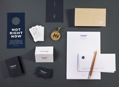 the stationery is laid out neatly on top of each other, including envelopes and business cards