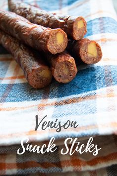 some very tasty looking snack sticks on a blue and white checkered table cloth