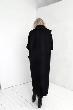 "Premium quality Black woolen coat has an oversize silhouette through the body , crafted in a heavy and thick high quality Italian wool fabric. Calf-length coat is fastened with two knobs. The coat has a unique cut , features big collar, long sleeves and is very stylish. This coat has a horizontal line through the front and back, there are large pockets in front. On one side on the shoulder is a decorative detail. The coat is with viscose lined. This coat is very stylish and unique created by a Trench Coat Winter, Winter Coat Black, Wool Coat Black, Black Trench Coat, Kimono Coat, Transparent Dress, Fast Fashion Brands, Elegant Coats, Winter Trench Coat