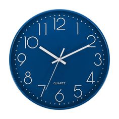 a blue wall clock with white numbers on the front and back of it's face