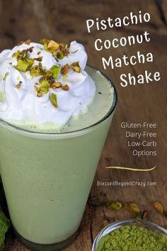 a green drink with whipped cream and pistachio