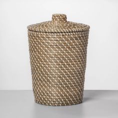 a large woven basket sitting on top of a table