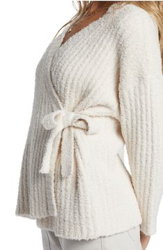 Dropped shoulders and a wrap-style silhouette lend welcome ease to a softly ribbed cardigan that's ready for relaxation. 24" length (size Medium) True wrap style with side tie closure Surplice V-neck Long sleeves Dropped shoulders 100% polyester Machine wash, dry flat Imported Soft Knit Wrap Sweater, Cozy Ribbed Cardigan For Loungewear, Cozy Wrap Cardigan For Loungewear, Soft Knit Wrap Cardigan, White Wrap Cardigan For Winter, Cozy Soft Knit Wrap Cardigan, Knitted Wrap Cardigan, Tie Up Cardigan, Scarf Cardigan