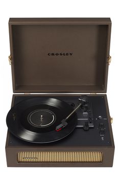 the crosley record player is open and ready to be played on it's turntable