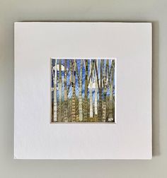 an image of a painting with trees in the background and blue sky above it on a white card