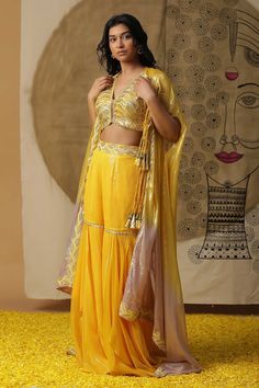 Lemon yellow blouse with all over hand embroidery. Paired with a palazzo with placement sequins, dori work hand embroidery and a cape with hand embroidery on borders and attached tassels. - Aza Fashions Fitted Chandbali Blouse Piece, Traditional Sleeveless Blouse With Dupatta, Anarkali Blouse With Gota Work, Georgette Blouse With Gota Work, Anarkali Style Choli With Cutdana, Unstitched Straight Kurta Blouse Piece, Unstitched Blouse Kurta For Navratri In Georgette, Front Open Kurta For Navratri, Navratri Sharara With Cutdana Detail