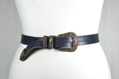 Full length buckle to end: 39''/98 cm Shortest wearable length: 31''/79 cm Longest wearable length: 35''/89 cm Width: 0.8''/2.7 cm In a good vintage condition. See my wide collection of other vintage belts: https://www.etsy.com/shop/RetroBelt?ref=seller-platform-mcnav Western Antique Belt Buckles For Festival, Vintage Leather Adjustable Belt Buckles, Rustic Antique Buckle Belt For Rodeo, Western Belts And Suspenders With Antique Buckle, Vintage Leather Belts And Suspenders With Matching Belt, Western Belts And Suspenders With Antique Buckle For Ranch, Rustic Antique Belt Buckle For Rodeo, Vintage Adjustable Belts And Suspenders With Brass Buckle, Western Belt With Antique Buckle And Adjustable Fit