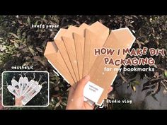 there is a person holding several packages in their hand with the words how i make diy packaging for my bookmarks