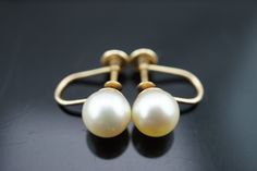 This is the perfect option for those who like cool, unique jewelry and luxury, the shine of gold and white. This earrings are well made, cute and/or elegant in design, and very desirable. The earrings are decorated with pearls. The earrings are screw back. The clasp is in good working condition. ♥ Age/Era: Circa before the 2000s. ♥ The earrings have a hallmark.14k. ♥ The earrings are about 5/8'' in diameter. The weight is 2.3g. Everyone interested in the jewelry should remember that he or she mu Classic White 14k Gold Bridal Earrings, Classic 14k Gold White Bridal Earrings, Classic Bridal Earrings In 14k White Gold, Fine Jewelry White Clip-on Earrings For Wedding, Classic Yellow Gold Wedding Earrings, Classic White Bridal Earrings, Wedding 14k Gold Clip-on Earrings, Fine Jewelry Yellow Gold Clip-on Earrings For Wedding, Formal White 14k Gold Bridal Earrings