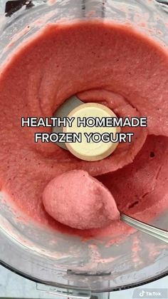 a food processor filled with frozen yogurt and a spoon in the bowl that says, healthy homemade frozen yogurt