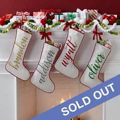 christmas stockings hanging over a fire place