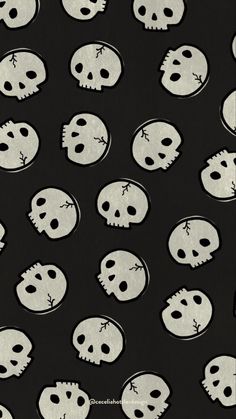 black and white skulls on a black background