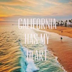 a beach with the words california has my heart on it