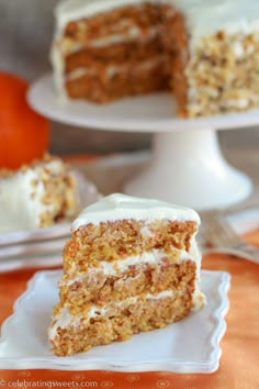 a slice of carrot cake on a plate with the rest of the cake in the background