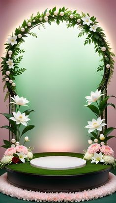 a round table with flowers and greenery on the top is surrounded by an arch