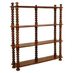 a wooden shelf with four shelves on it