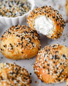 sesame seed bagels with cream cheese in the middle