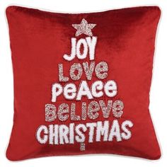 a red pillow with the words joy love peace believe christmas