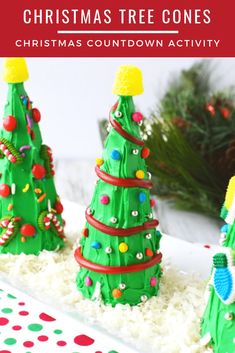 three christmas trees made out of cake and icing on a plate with white rice