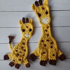 two crocheted giraffes sitting next to each other