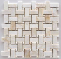 a white and beige mosaic tile pattern