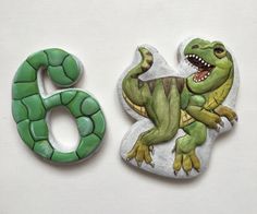 the number six is made to look like a dinosaur