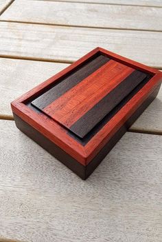 a wooden box sitting on top of a wooden floor