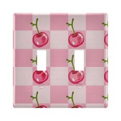 pink checkered light switch cover with two cherries on the front and one cherry on the back