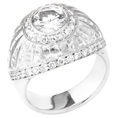 Elevate your sense of luxury with this Italian-crafted ring by the esteemed jeweler Fulvio Maria Scavia. A focal point of this exquisite piece is a dazzling white round brilliant cut diamond, artfully set in white gold and surrounded by a delicate embrace of white diamond pavé. The diamond, weighing 1.21 carats and certified by IGI as EVVS1, sparkles with a brilliance that captivates. Adding a touch of unique sophistication is a hand-carved hyaline quartz inlay, contributing a translucent elegan Pave Diamond Band, Pave Band, Contemporary Ring, Round Brilliant Cut Diamond, Cluster Ring, Brilliant Cut Diamond, Intricate Details, Pave Diamonds, White Diamond