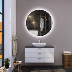 a bathroom with a sink, mirror and towel rack in it's center area