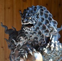 a statue of a demon with its mouth open