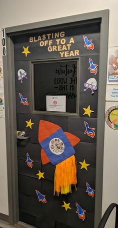 a bulletin board with a rocket ship on it