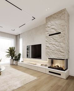 a modern living room with a fireplace and tv on the wall in front of it