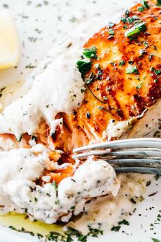 a close up of a plate of food with chicken and mashed potatoes on it