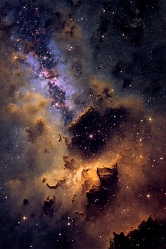 an image of the galactic sky with stars and clouds in it, taken from space